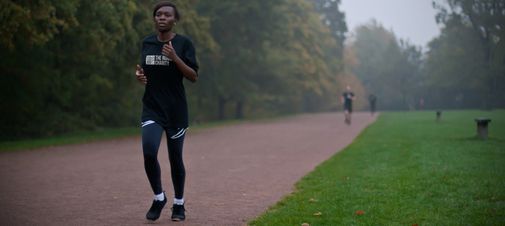 Female TRC member running on a track